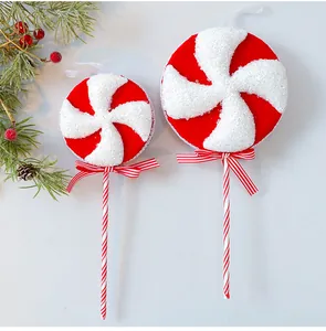 Detailed view of red and white glitter foam lollipop Christmas tree ornaments