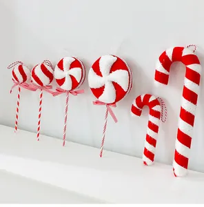 Detailed view of red and white striped foam candy and lollipop Christmas tree ornaments