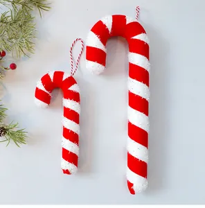 Detailed view of red and white striped foam candy cane Christmas tree hanging ornaments.