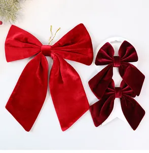 Detailed view of red velvet Christmas bows ornaments for festive holiday tree decoration