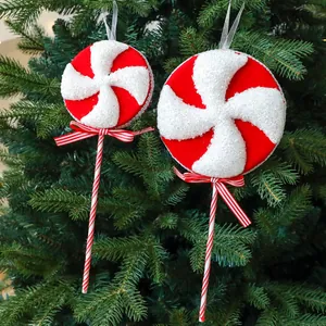 Red and white swirl foam lollipop Christmas tree ornaments with festive bows