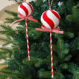 Festive red and white striped lollipop candy cane ornaments for Christmas tree decoration