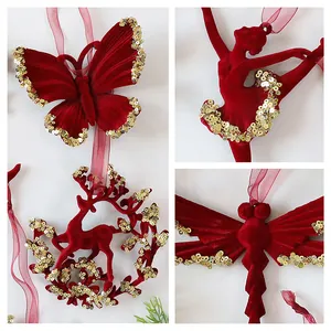 Detailed view of burgundy flocked Christmas ornaments with gold sequins in various shapes