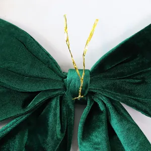 Large dark green velvet Christmas bow decoration with gold twist tie for tree decor
