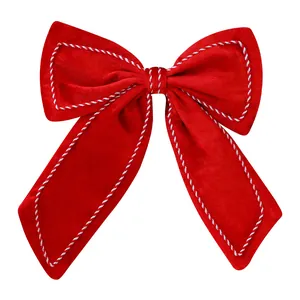 Large red velvet Christmas bow with twisted cord trim for tree and window decoration