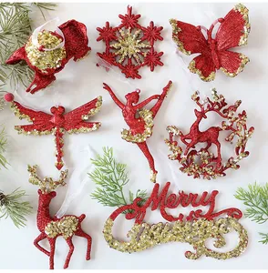 Close-up of red and gold glitter sequin Christmas ornaments with festive designs