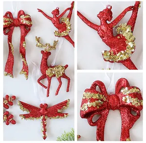 Detailed view of festive red Christmas ornaments with sparkling gold sequins and glitter