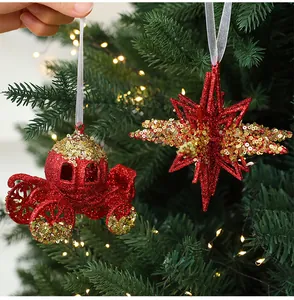 Detail view of sparkling red and gold sequin star and carriage Christmas tree ornaments