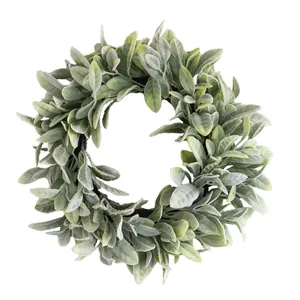 Detailed macro view of soft artificial green lamb's ear leaves on a round wreath