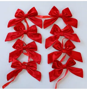 Detailed view of red velvet bow garland for Christmas tree and window decoration