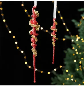 Detailed macro view of red glitter Christmas icicle hanging ornaments with gold sequins