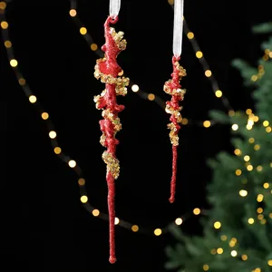 Red glitter icicle Christmas ornaments with gold sequins for festive tree decoration
