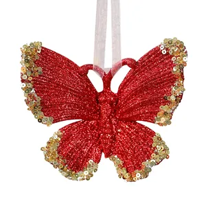 Glittery red butterfly Christmas ornament with gold sequins and hanging ribbon