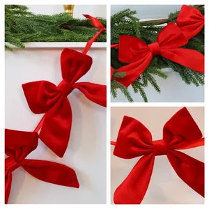 Red velvet bow garland for Christmas tree decoration and festive window hanging