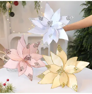 Drei funkelnde künstliche Weihnachtsstern-Blumen in Weiß, Rosa und Champagner-Gold.