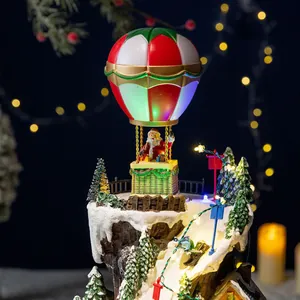 Animated Christmas musical box featuring hot air balloon Santa and glowing LED snow village scene