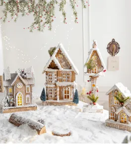 Charming wooden Christmas house decorations with fallen snow and warm glowing lights