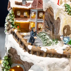 Intricate luminous rotating Christmas village music box featuring a detailed winter snow scene