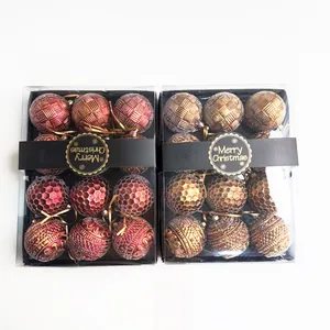 Detailed view of red and gold 8cm textured Christmas ball ornaments in boxes