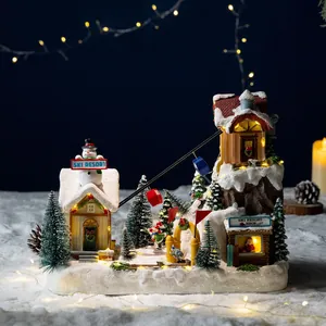 Illuminated Christmas ski resort music box with rotating cable car and warm LED lights