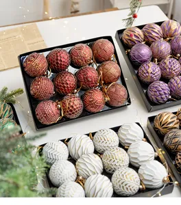 Detailed macro shot of textured Christmas ball ornaments in assorted colors and patterns.
