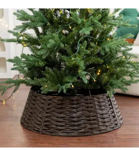 Close-up of a dark brown hand-woven wicker Christmas tree collar at the tree base
