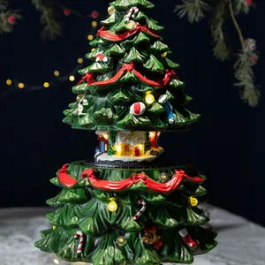 Lichtgevende kerstboom muziekdoos met draaiend dorpsgezicht en warme LED-lampjes