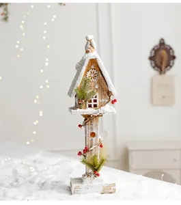 Rustic wooden snowy Christmas house ornament with LED lights and berries