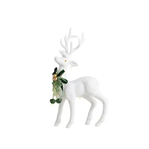 Elegante renna di Natale bianca floccata con fiocco di velluto verde e campanelli