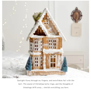 Close-up of a rustic wooden Christmas house with artificial snow and mini trees