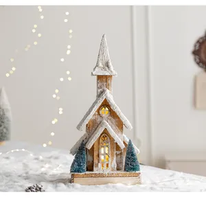 Luminous wooden Christmas church with snow detail and warm lights