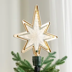 Eleganter goldener LED Weihnachtsbaumstern für die festliche Feiertagsdekoration zu Hause