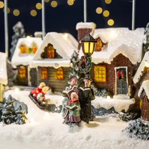Festive Christmas village resin house music box with warm glowing lights and carollers