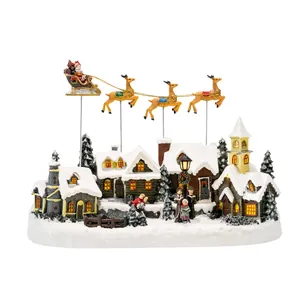 Christmas village decoration with flying reindeer sleigh and light-up resin houses