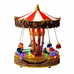 Feestelijke kerstcarrousel muziekdoos met vliegende stoelen en gekleurde LED-lampjes