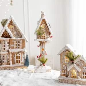 Nordic wooden Christmas houses with LED lights and snow effect for holiday tabletop decor.