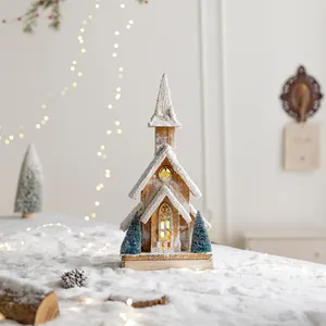 Nordic wooden Christmas church with LED lights and artificial snow for holiday decor.