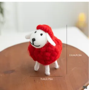 Handmade red wool felt sheep ornament for Christmas decor, showing size and weight labels.