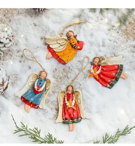 Close-up of four retro painted resin angel ornaments with heart and star details
