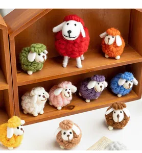 Collection of handmade colorful felt sheep miniatures displayed on a rustic wooden shelf