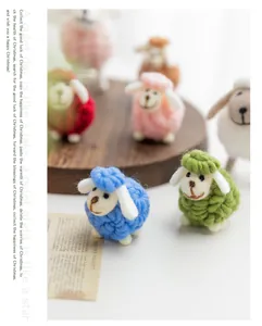 Detailed shot of colorful handmade wool felt sheep ornaments for Christmas decor