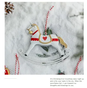 Detailed view of retro metal rocking horse ornament with heart pattern and bell