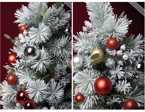 Close-up detail of 24PCS red and gold Christmas ball ornaments on snowy pine tree branches.
