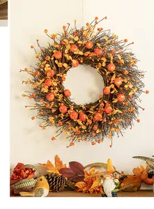 Autumn harvest wreath with mini pumpkins and dry branches for front door decoration