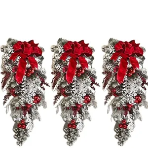 Beautiful set of three 50cm flocked Christmas teardrop swags with red velvet bows.
