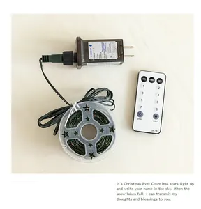 Detail view of LED star string light set with power adapter and remote control
