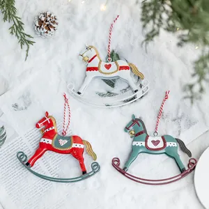 Handcrafted vintage iron Christmas rocking horse ornaments in red white and teal colors