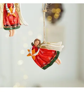 Detailed view of hand-painted resin Christmas angel ornaments with hanging hemp rope