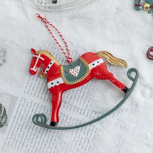 Vintage red iron rocking horse Christmas tree ornament on decorative snow background