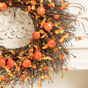 Autumn harvest wreath featuring mini pumpkins and berries for front door decor